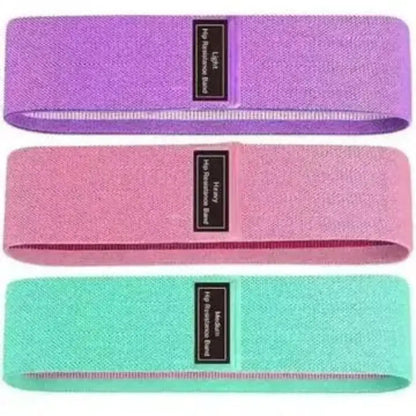 Set de tres bandas de resistencia de tela en colores morado, rosado y turquesa, detallando los niveles de tensión light, medium y heavy.