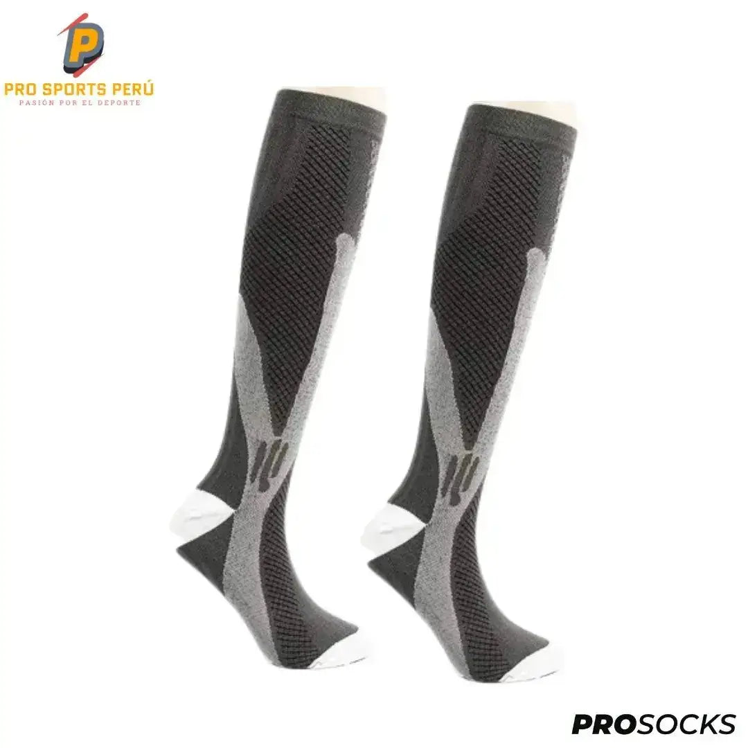 Par de medias de compresión largas color plomo oscuro con gris para entrenamiento en gimnasio y running.